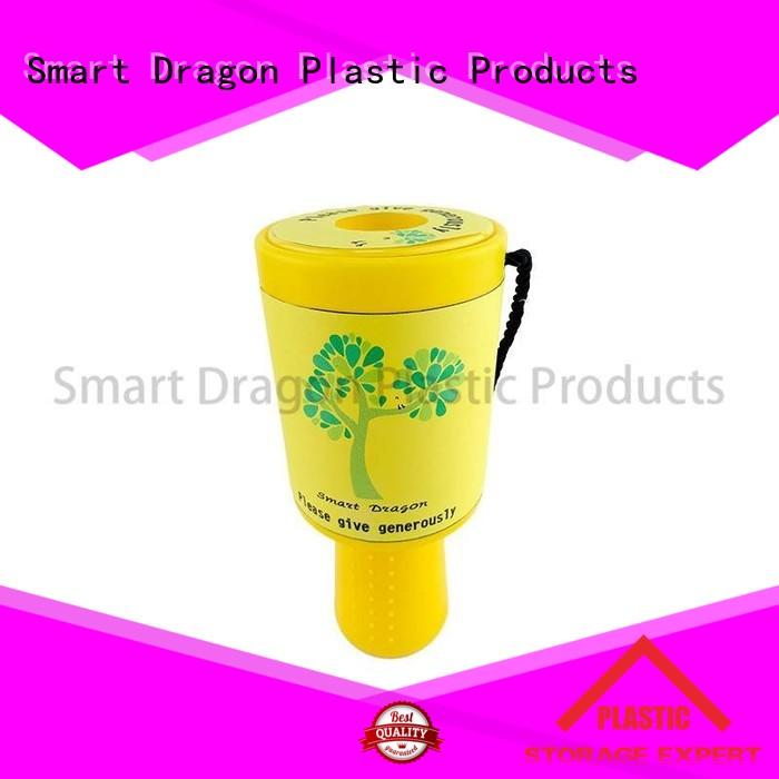 green donation box held for charity collection SMART DRAGON